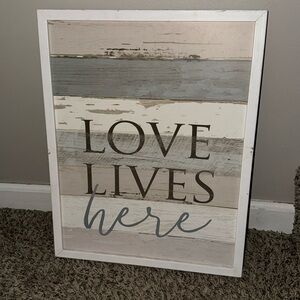 LOVE LIVES HERE sign